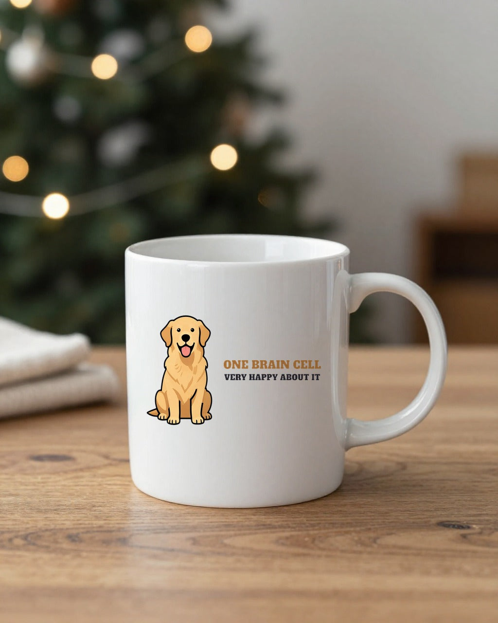 One Brain Cell golden retriever mug on a table by a Christmas tree